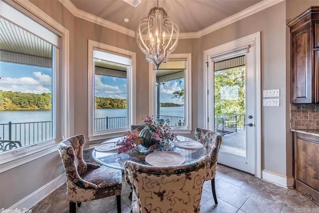 6550 Westminster, Benton, AR 72019 - dining room featuring light tile patterned floors, baseboards, an inviting chandelier, and crown molding