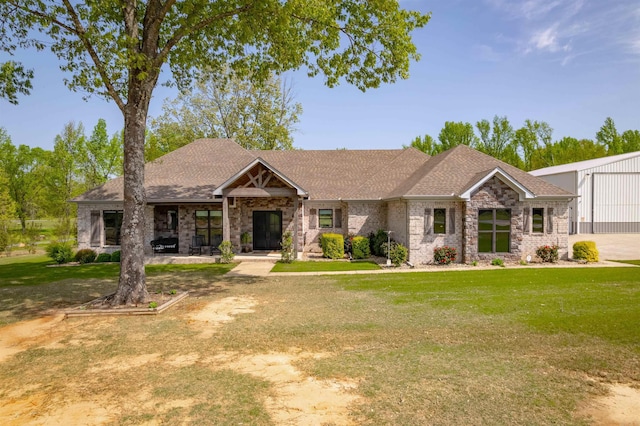 234 Barrett Ln, Cabot, AR 72023 - view of front of property featuring a front yard, brick siding, and a shingled roof