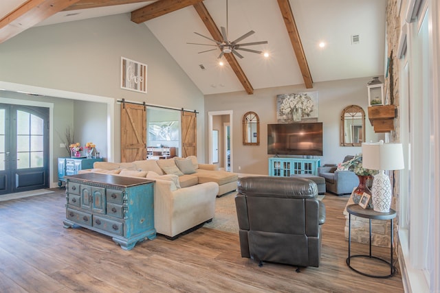 234 Barrett Ln, Cabot, AR 72023 - living room with a barn door, beamed ceiling, ceiling fan, high vaulted ceiling, and wood finished floors