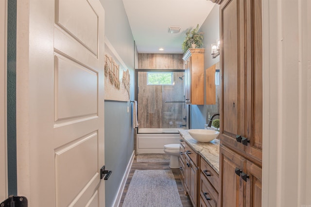 234 Barrett Ln, Cabot, AR 72023 - full bath featuring shower / bath combination with glass door, vanity, toilet, visible vents, and wood finished floors
