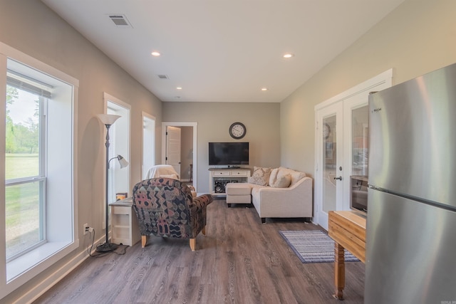 234 Barrett Ln, Cabot, AR 72023 - living room with recessed lighting, french doors, wood finished floors, and a healthy amount of sunlight