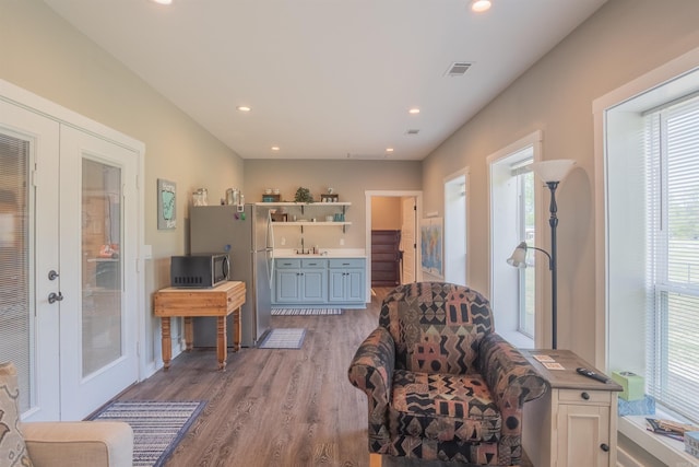 234 Barrett Ln, Cabot, AR 72023 - living area with light wood-style flooring, french doors, visible vents, and recessed lighting
