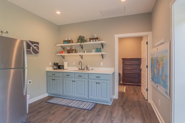 234 Barrett Ln, Cabot, AR 72023 - kitchen with freestanding refrigerator, dark wood-type flooring, visible vents, a sink, and light countertops
