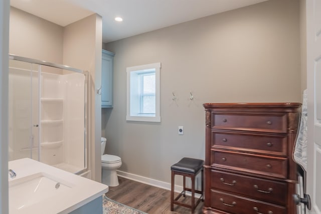 234 Barrett Ln, Cabot, AR 72023 - full bath with vanity, baseboards, toilet, a shower stall, and wood finished floors