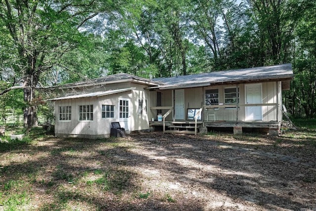 back of house with a porch