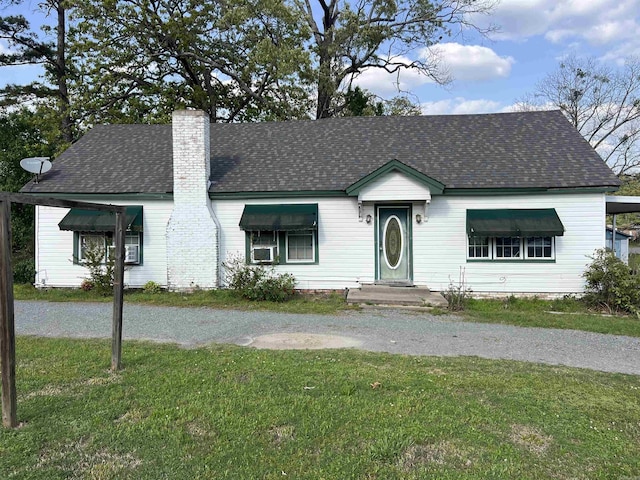 8209 Dollarway Rd, White Hall, AR 71602 - view of front of property with a chimney, a front lawn, and roof with shingles