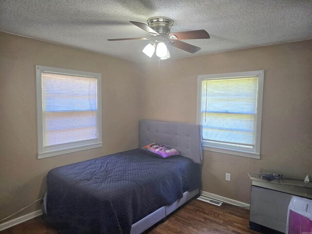 801 Randall Dr, Searcy, AR 72143 - bedroom featuring dark wood-type flooring, visible vents, baseboards, and multiple windows