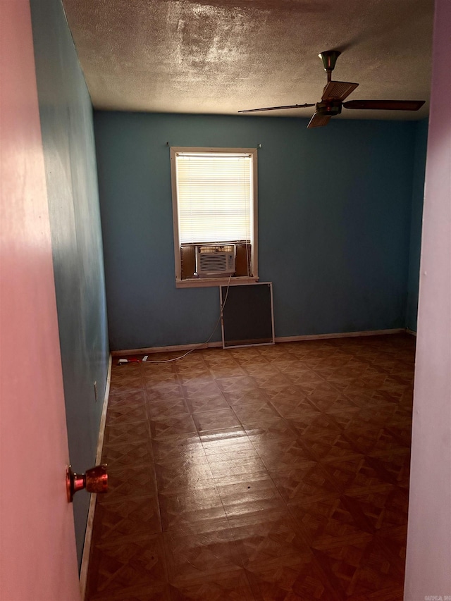 spare room featuring ceiling fan and a textured ceiling