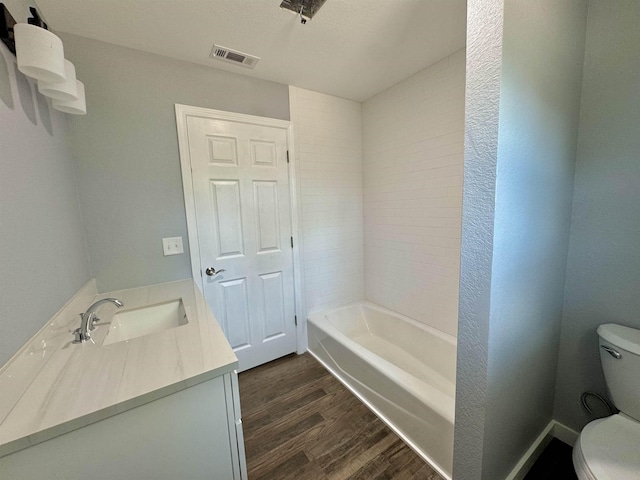 full bathroom with vanity, visible vents, toilet, and wood finished floors