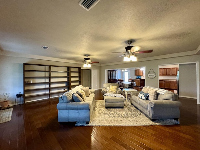 25 Heritage Ln, Melbourne, AR 72556 - living area with visible vents, dark wood-style floors, and ceiling fan