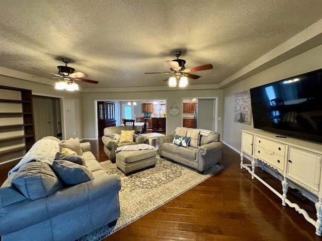 25 Heritage Ln, Melbourne, AR 72556 - living area featuring a textured ceiling, a ceiling fan, and dark wood-style flooring