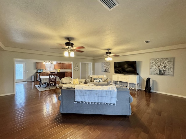 25 Heritage Ln, Melbourne, AR 72556 - living area featuring dark wood-style floors, a textured ceiling, and ceiling fan