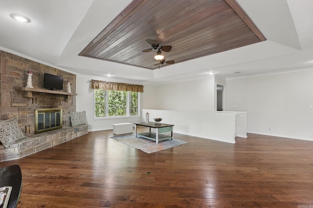 6 Narvaez Way, Hot Springs Village, AR 71909 - living area featuring a tray ceiling, a ceiling fan, hardwood / wood-style flooring, a fireplace, and ornamental molding