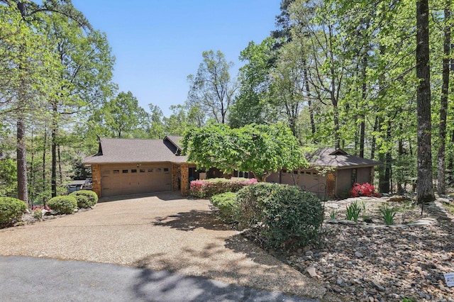 6 Narvaez Way, Hot Springs Village, AR 71909 - view of front facade featuring concrete driveway, roof with shingles, and a garage