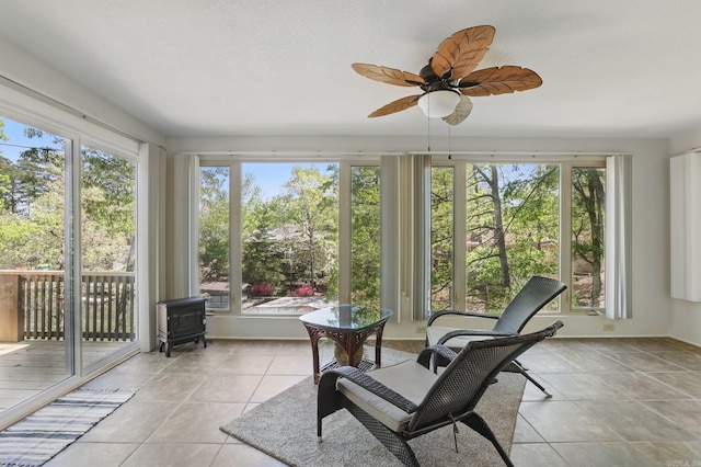 6 Narvaez Way, Hot Springs Village, AR 71909 - sunroom / solarium with a healthy amount of sunlight, a wood stove, and tile patterned floors