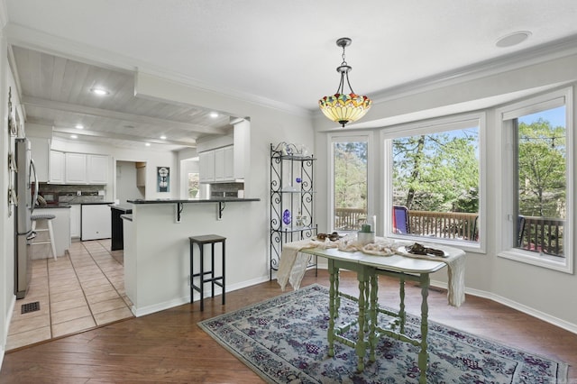 6 Narvaez Way, Hot Springs Village, AR 71909 - dining area featuring wood finished floors, a healthy amount of sunlight, baseboards, and ornamental molding