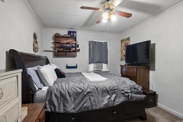 bedroom with cooling unit, ceiling fan, baseboards, ornamental molding, and carpet flooring