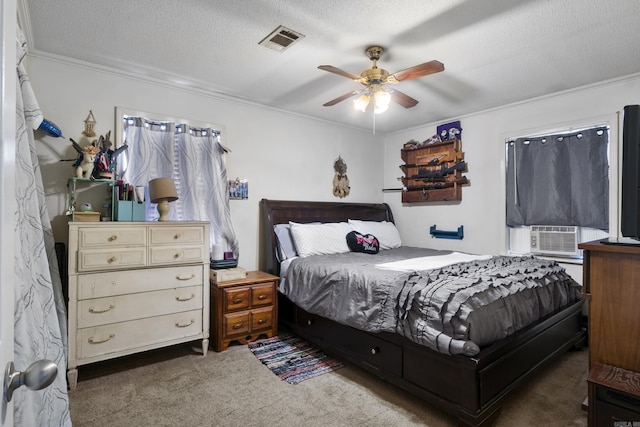carpeted bedroom featuring cooling unit, a ceiling fan, visible vents, and crown molding