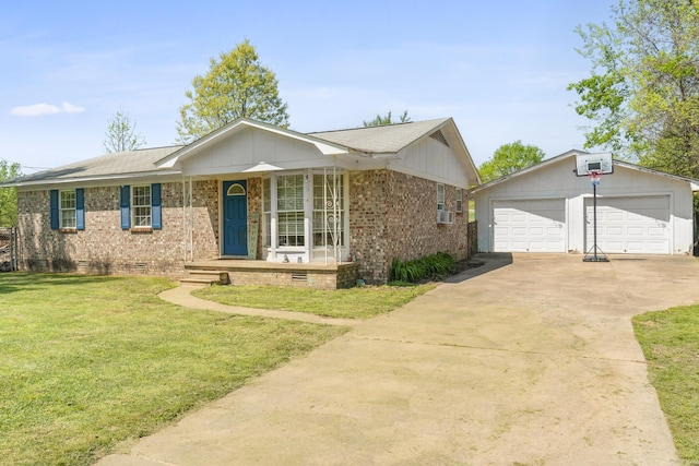 ranch-style home featuring a front lawn, an outbuilding, covered porch, a detached garage, and brick siding
