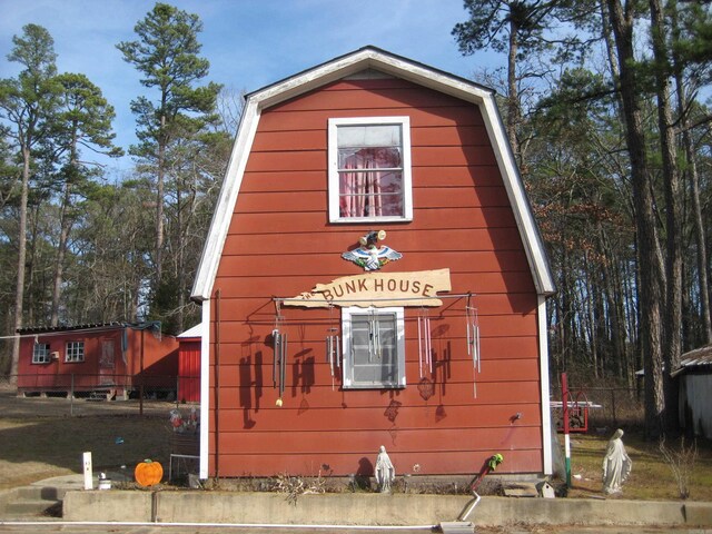 exterior space with a gambrel roof