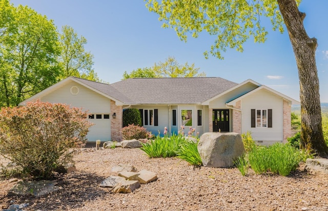 single story home featuring brick siding, an attached garage, and roof with shingles