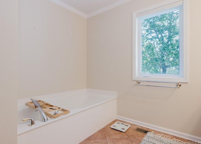 full bath with tile patterned floors, a bath, baseboards, ornamental molding, and visible vents