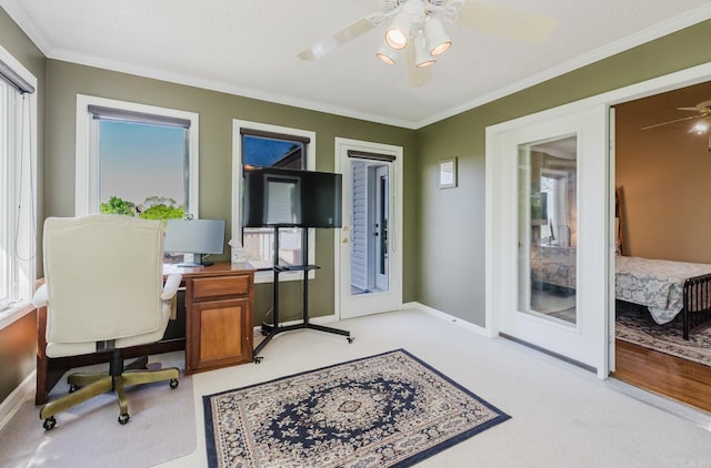 office with light colored carpet, ceiling fan, baseboards, and ornamental molding