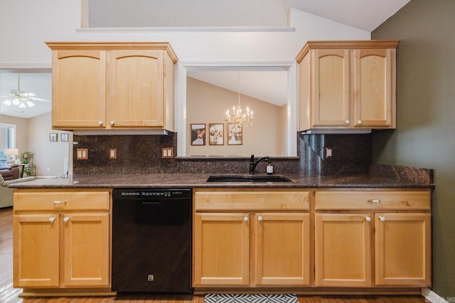 kitchen featuring dishwasher, vaulted ceiling, light brown cabinetry, and a sink