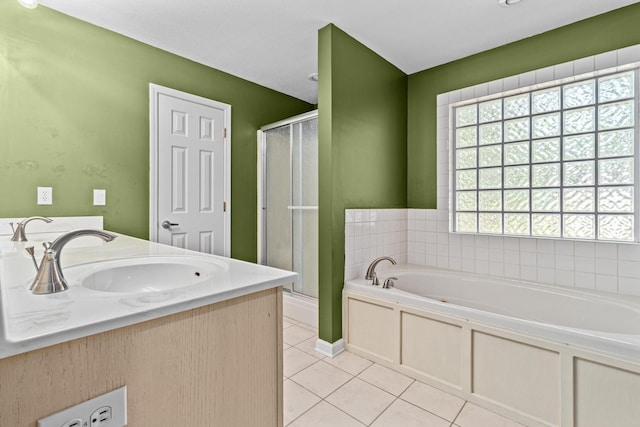 full bath with a shower stall, a sink, a bath, double vanity, and tile patterned flooring