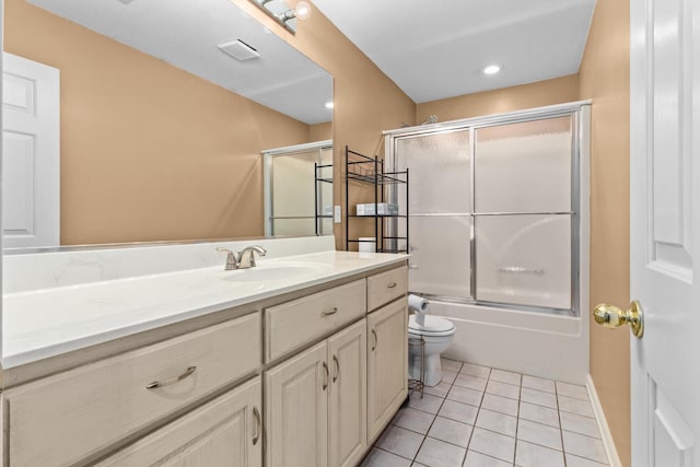 bathroom with tile patterned floors, visible vents, combined bath / shower with glass door, vanity, and toilet