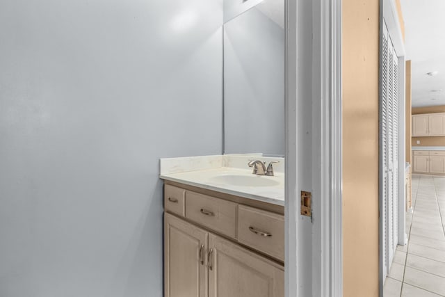 bathroom with tile patterned floors and vanity