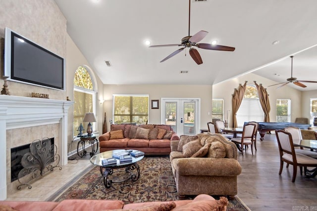 living area with recessed lighting, visible vents, a ceiling fan, a fireplace, and high vaulted ceiling