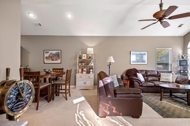 living area featuring vaulted ceiling, a ceiling fan, light carpet, visible vents, and recessed lighting