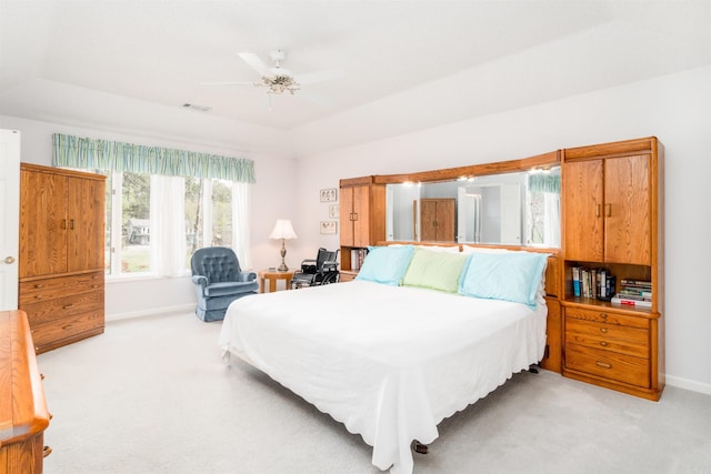 18 Fastota Ln, Hot Springs Village, AR 71909 - bedroom featuring a raised ceiling, visible vents, baseboards, light colored carpet, and ceiling fan
