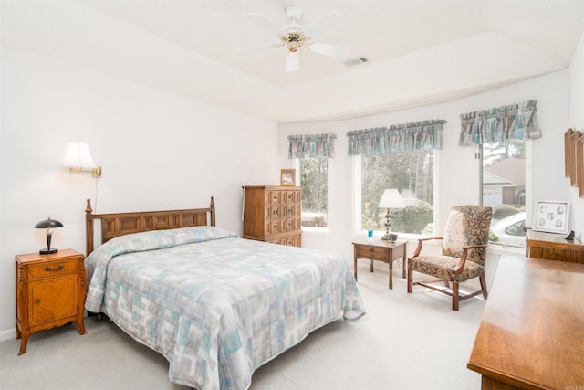 18 Fastota Ln, Hot Springs Village, AR 71909 - bedroom featuring light colored carpet, a ceiling fan, a tray ceiling, and visible vents