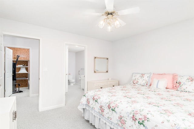 18 Fastota Ln, Hot Springs Village, AR 71909 - bedroom with ceiling fan, baseboards, connected bathroom, and light colored carpet