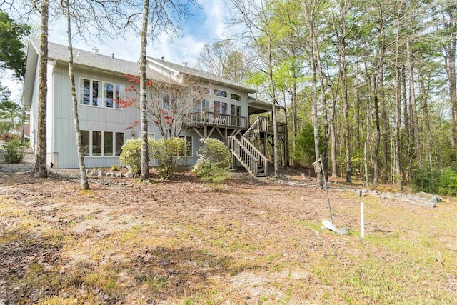 18 Fastota Ln, Hot Springs Village, AR 71909 - rear view of house featuring stairway and a deck