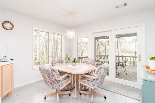 18 Fastota Ln, Hot Springs Village, AR 71909 - dining area with an inviting chandelier, visible vents, light tile patterned floors, and a healthy amount of sunlight