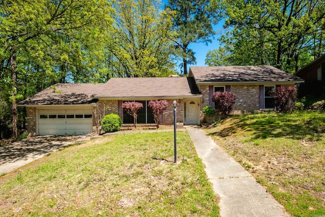 309 Del Rio Dr, Little Rock, AR 72205 - ranch-style house with driveway, brick siding, a front yard, and a garage
