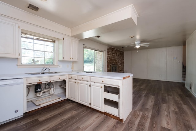 309 Del Rio Dr, Little Rock, AR 72205 - kitchen with white cabinets, dishwasher, visible vents, a sink, and a peninsula