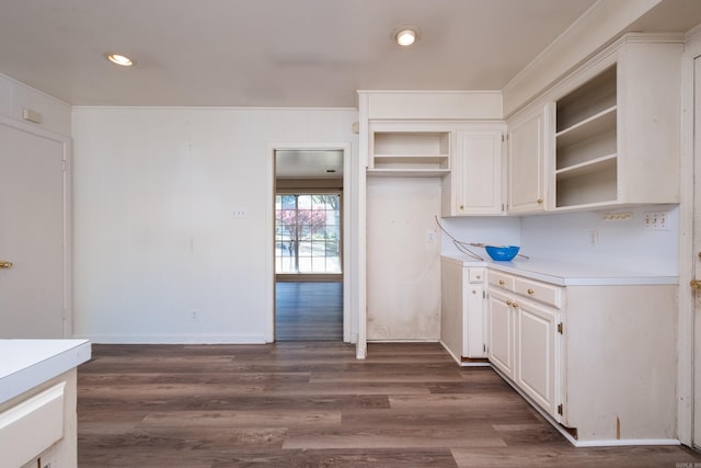 309 Del Rio Dr, Little Rock, AR 72205 - kitchen featuring open shelves, light countertops, white cabinets, and dark wood-type flooring