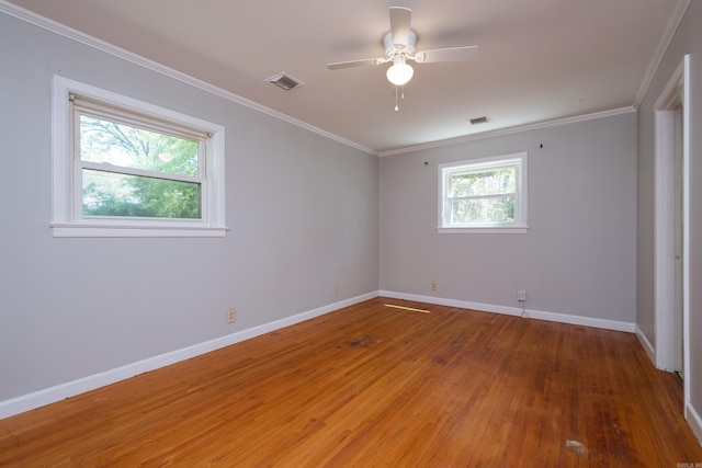 309 Del Rio Dr, Little Rock, AR 72205 - unfurnished bedroom featuring baseboards, ornamental molding, light wood-style floors, and visible vents