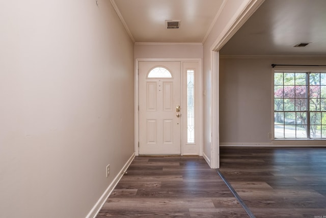 309 Del Rio Dr, Little Rock, AR 72205 - foyer with dark wood-style floors, baseboards, ornamental molding, and visible vents