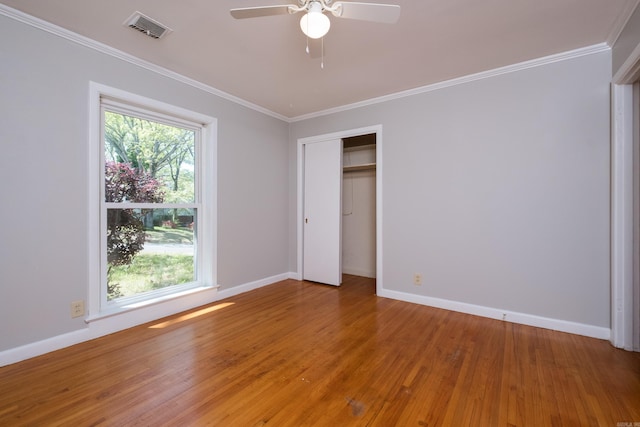309 Del Rio Dr, Little Rock, AR 72205 - unfurnished bedroom featuring light wood finished floors, baseboards, visible vents, a closet, and crown molding