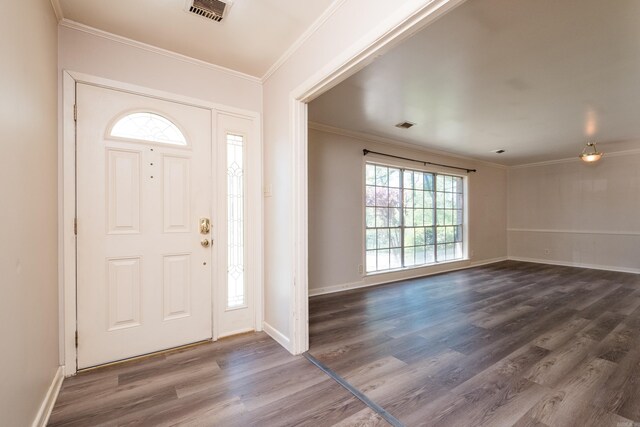 309 Del Rio Dr, Little Rock, AR 72205 - entrance foyer with baseboards, visible vents, crown molding, and dark wood-style floors