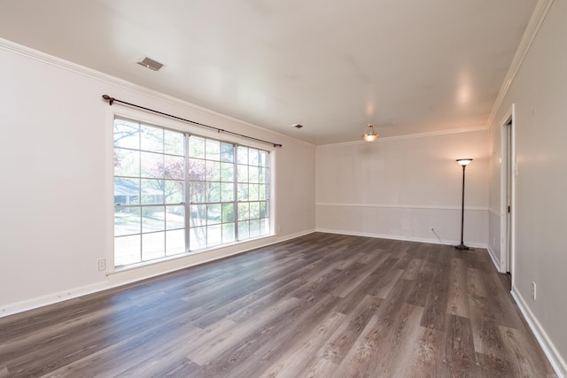309 Del Rio Dr, Little Rock, AR 72205 - empty room featuring baseboards, ornamental molding, visible vents, and dark wood-style floors