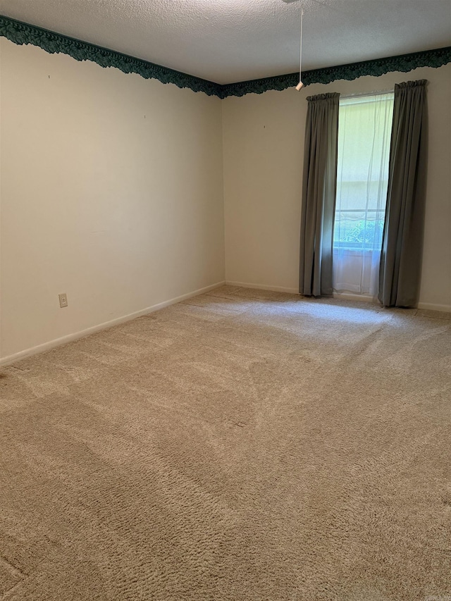 23 Dalewood, Searcy, AR 72143 - unfurnished room featuring a textured ceiling, baseboards, and light carpet