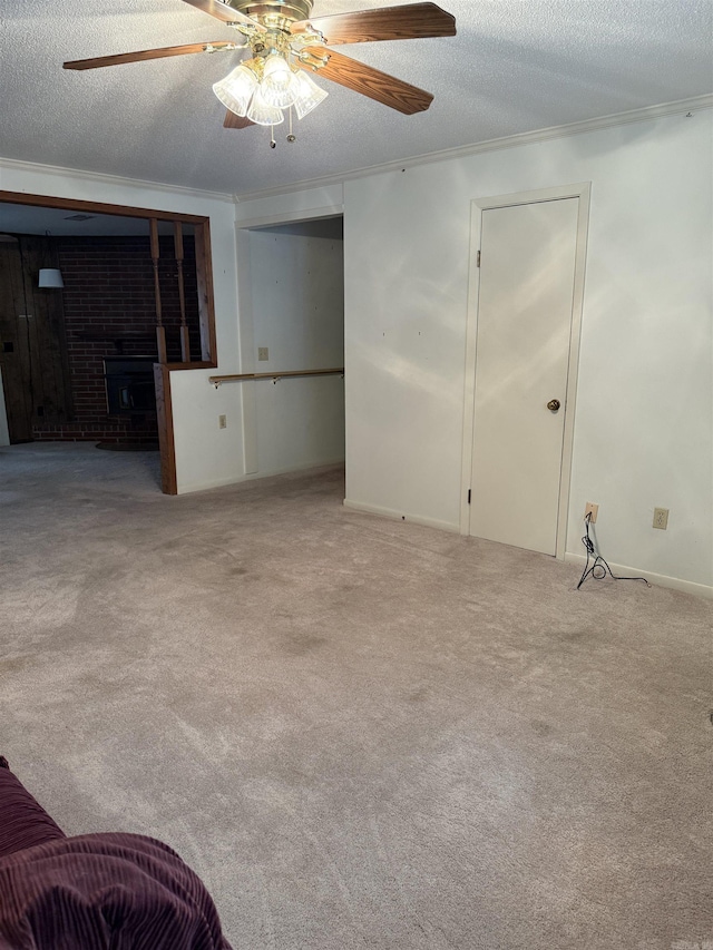 23 Dalewood, Searcy, AR 72143 - unfurnished living room with carpet floors, crown molding, a brick fireplace, and a textured ceiling