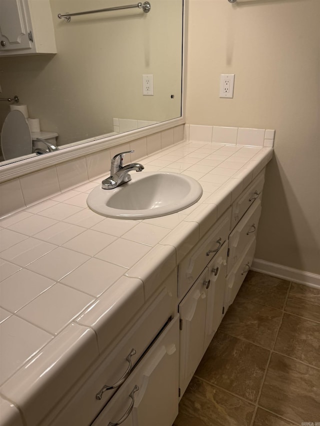 23 Dalewood, Searcy, AR 72143 - bathroom featuring baseboards and vanity