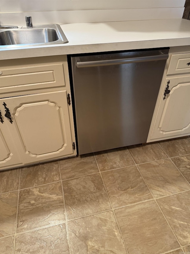 23 Dalewood, Searcy, AR 72143 - kitchen with stainless steel dishwasher, light countertops, a sink, and white cabinetry